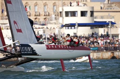 Luna Rossa, leader of the ESS,  racing in front of cheering fans - Extreme Sailing Series 2011 Act 6. The team will work with ETNZ, out of Auckland,  in 2012 and beyond.<br />
 © Lloyd Images http://lloydimagesgallery.photoshelter.com/