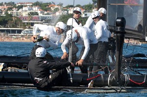 Oracle Racing helmsman James Spithill sprays his crew with champagne as he celebrates his winning the Match Racing 2-0 against Emirates Team New Zealand. Day six of the America's Cup World Series, Cascais, Portugal. 13/8/2011 photo copyright Chris Cameron/ETNZ http://www.chriscameron.co.nz taken at  and featuring the  class
