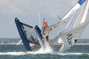 Dramatic capsize for Aberdeen Asset Management in Act 5, race 6 of day 3 at Cowes - Extreme Sailing Series photo copyright Lloyd Images http://lloydimagesgallery.photoshelter.com/ taken at  and featuring the  class