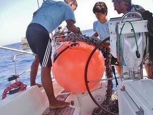 Le Roux retrieving large buoy found floating with long line attached copy photo copyright  SW taken at  and featuring the  class