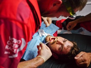 Onboard medic Tony Rae administers three stitches and anaesthetic to CAMPER with Emirates Team New Zealand bowman Mike Pammenter - photo © Hamish Hooper/Camper ETNZ/Volvo Ocean Race