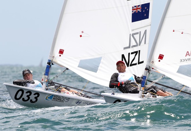 Andrew Murdoch (033) of New Zealand and Phillip Buhl of Germany compete on day 12 during the Laser - Men&rsquo;s One Person Dinghy event of the 2011 ISAF Sailing World Championships &copy; Paul Kane /Perth 2011 http://www.perth2011.com