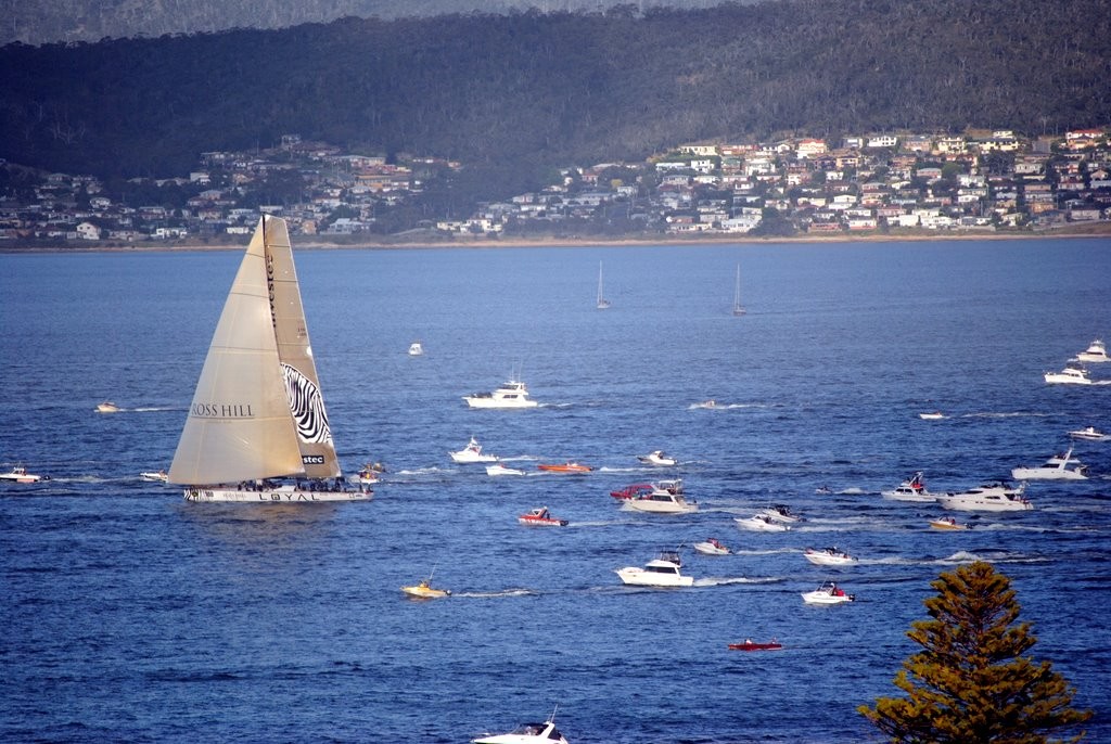 Investec Loyal leading Wild Oats past Sandy Bay to win the 67th Rolex Sydney Hobart Race just before 7.15pm © Rob Cruse