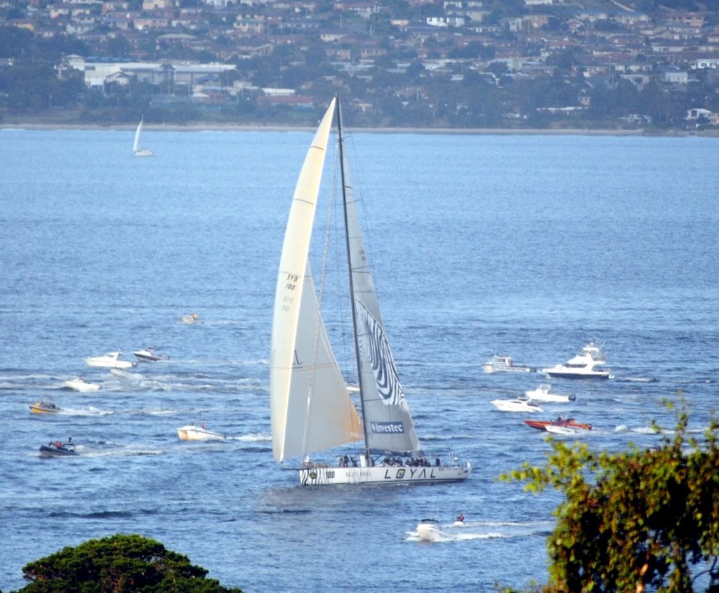 Investec Loyal leading Wild Oats past Sandy Bay to win the 67th Rolex Sydney Hobart Race just before 7.15pm © Rob Cruse
