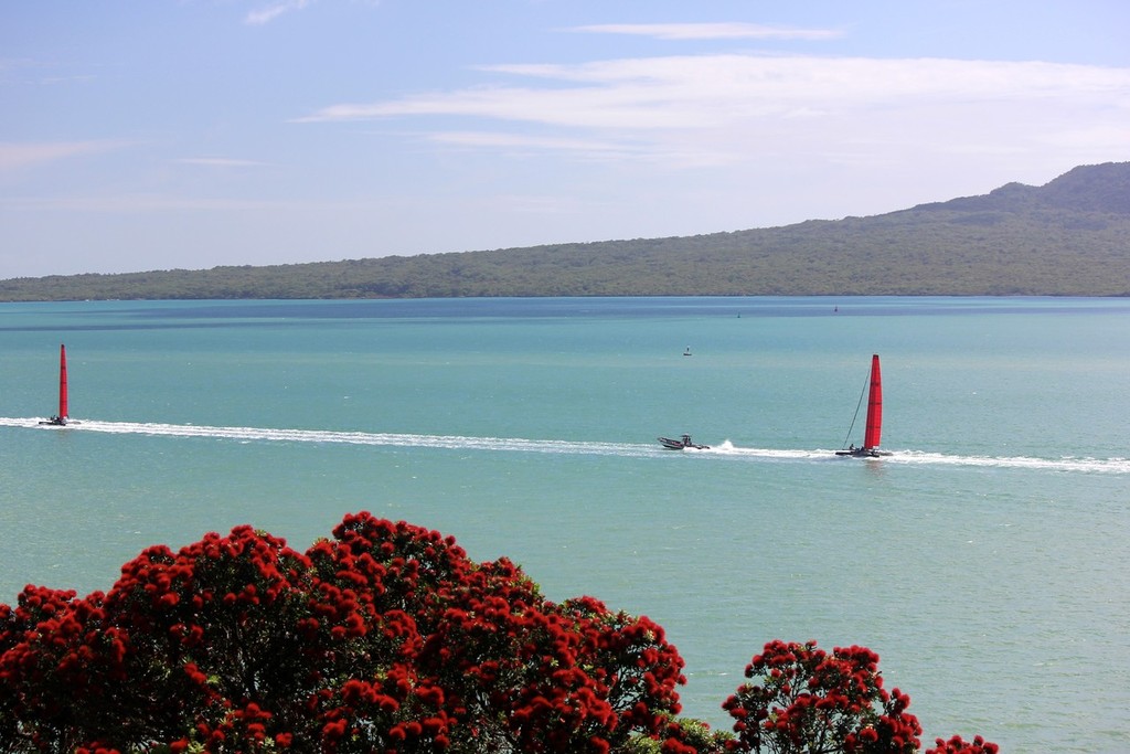 The two SL-33’s head out into the Gulf past a pohutukawa (NZ Christmas tree) in full bloom. © Ben Gladwell http://www.sail-world.com/nz