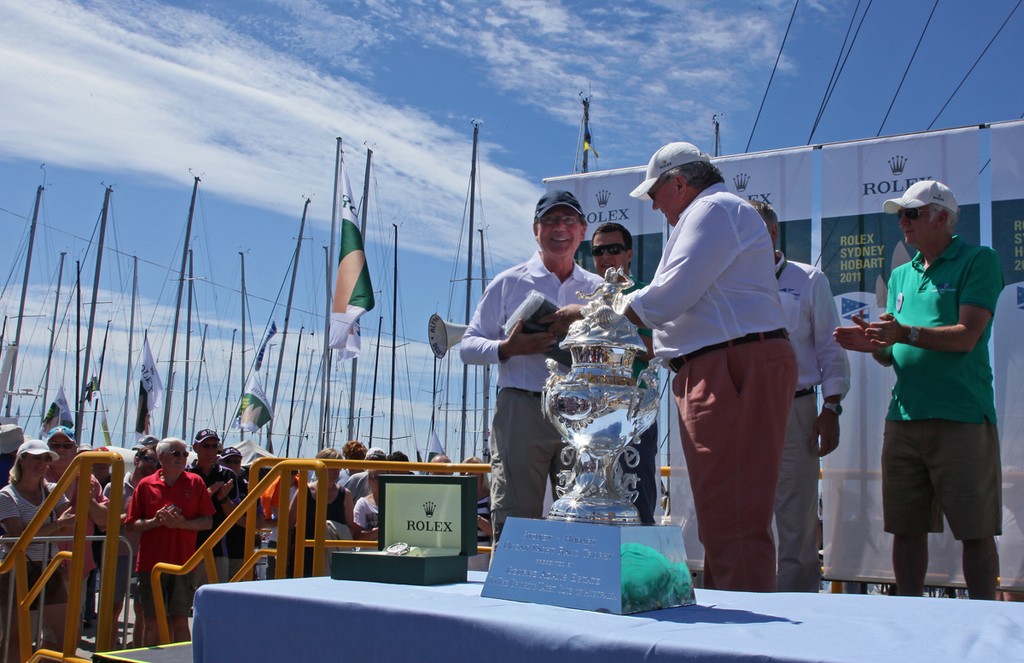 Darryl Hodgkinson, skipper of Victoire collects his battle flags for winning IRC Division 3 and ORCi Division 2 - Rolex Sydney Hobart Yacht Race 2011 photo copyright Crosbie Lorimer http://www.crosbielorimer.com taken at  and featuring the  class