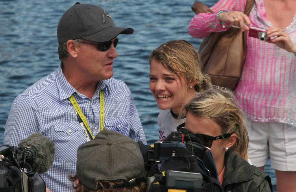 A wet Jessica Watson with her manager Andrew Fraser - Rolex Sydney Hobart Yacht Race 2011 photo copyright Crosbie Lorimer http://www.crosbielorimer.com taken at  and featuring the  class