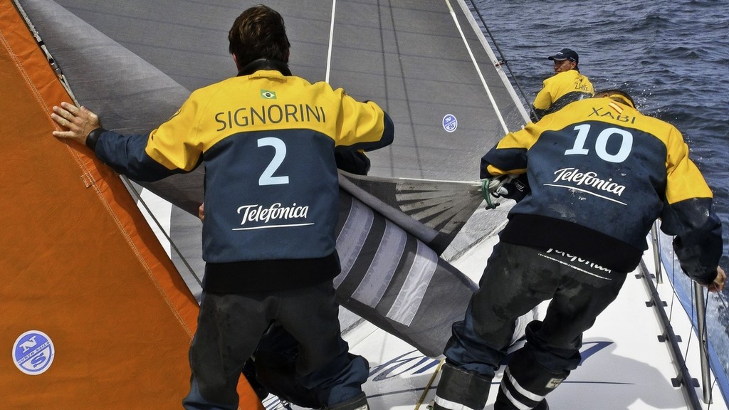 Joao Signorini from Brasil and Xabi Fernandez from Spain struggling with the sail onboard Team Telefonica during leg 2 of the Volvo Ocean Race 2011-12, from Cape Town, South Africa to Abu Dhabi, UAE.  © Diego Fructuoso /Team Telefónica/Volvo Ocean Race http://www.volvooceanrace.com