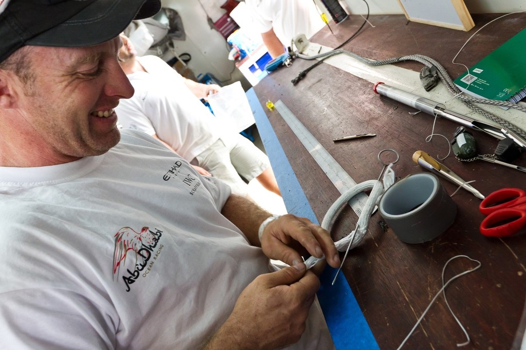 Justin Slattery from Abu Dhabi Ocean Racing, working on the mast during the Volvo Ocean Race 2011-12 Cape Town stopover. © Ian Roman/Volvo Ocean Race http://www.volvooceanrace.com