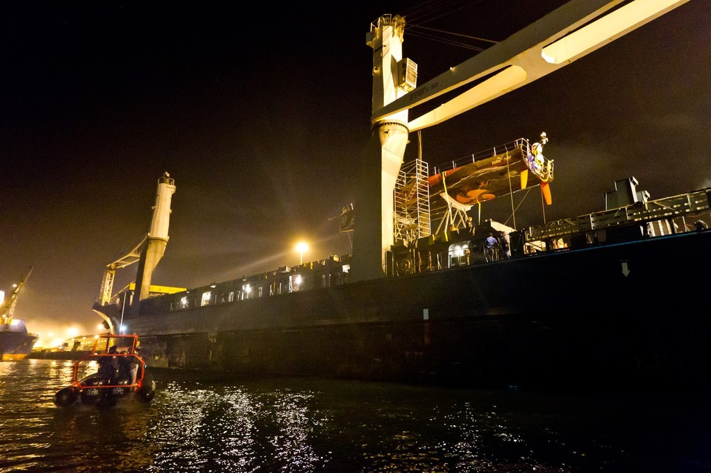 Support crew in a RIB alongside the container ship Team Bremen as final preparations are made for the offloading of Mar Mostro in Cape Town.  © Ian Roman/Volvo Ocean Race http://www.volvooceanrace.com