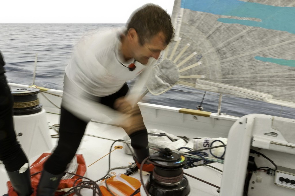 Richard Mason grinds the tack down on the code 0 onboard Team Sanya during leg 2 of the Volvo Ocean Race 2011-12, from Cape Town, South Africa to Abu Dhabi, UAE. © Andres Soriano/Team Sanya/Volvo Ocean Race
