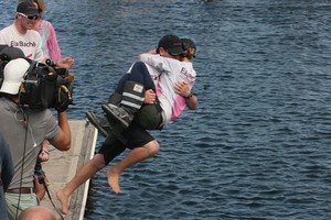 Crew member Peter Woodward takes Jessica for a swim - Rolex Sydney Hobart Yacht Race 2011 photo copyright Crosbie Lorimer http://www.crosbielorimer.com taken at  and featuring the  class