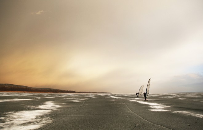 Hungarian olympian Laser sailor Zsombor Berecz (2008 Beijing - qualified 2012 London) ice surfing on the Lake Balaton. - Ice surfing on the Lake Balaton, Hungary © Gabor Turcsi