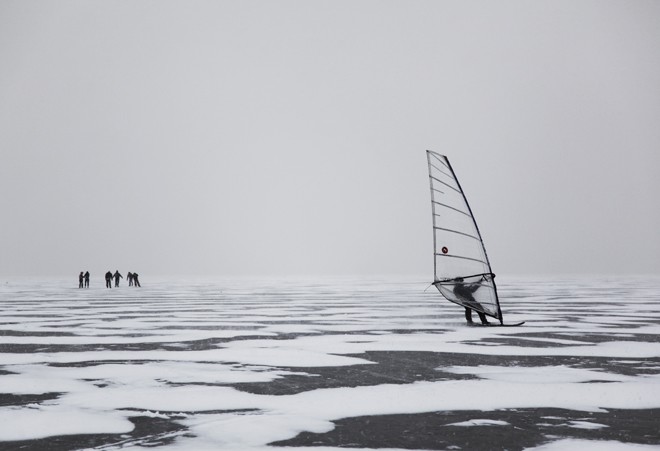 Hungarian olympian Laser sailor Zsombor Berecz (2008 Beijing - qualified 2012 London) ice surfing on the Lake Balaton. - Ice surfing on the Lake Balaton, Hungary © Gabor Turcsi