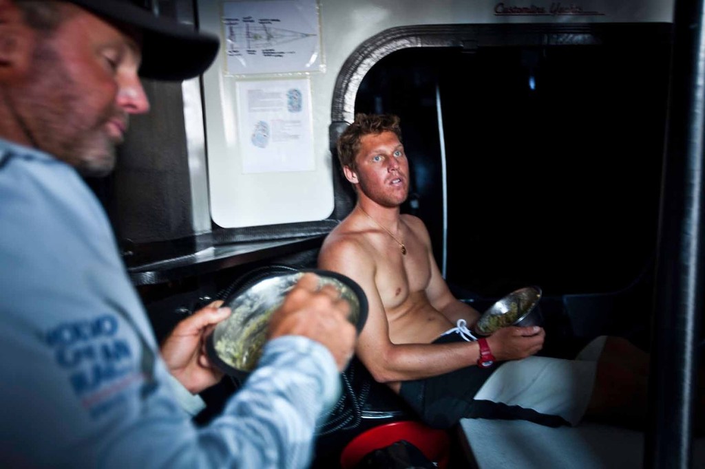 Rome Kirby (R) and Jono Swain (L), watch partners, eating lunch before going up on deck. PUMA Ocean Racing powered by BERG during leg 4 of the Volvo Ocean Race 2011-12 © Amory Ross/Puma Ocean Racing/Volvo Ocean Race http://www.puma.com/sailing