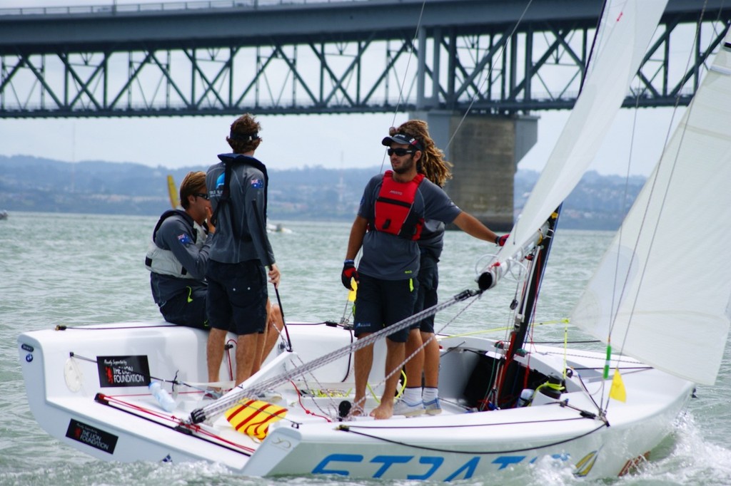 Jordan Reece (RSYS) and crew discuss tactics before the next race - HARKEN Youth International Match Racing Championships photo copyright Sara Tucker taken at  and featuring the  class