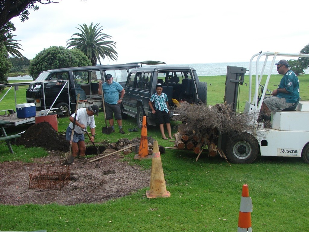 Joint effort: Locals and competitors working together for the Hangi - 2012 Europe Dinghy Global Veteran Cup © Andy Greager