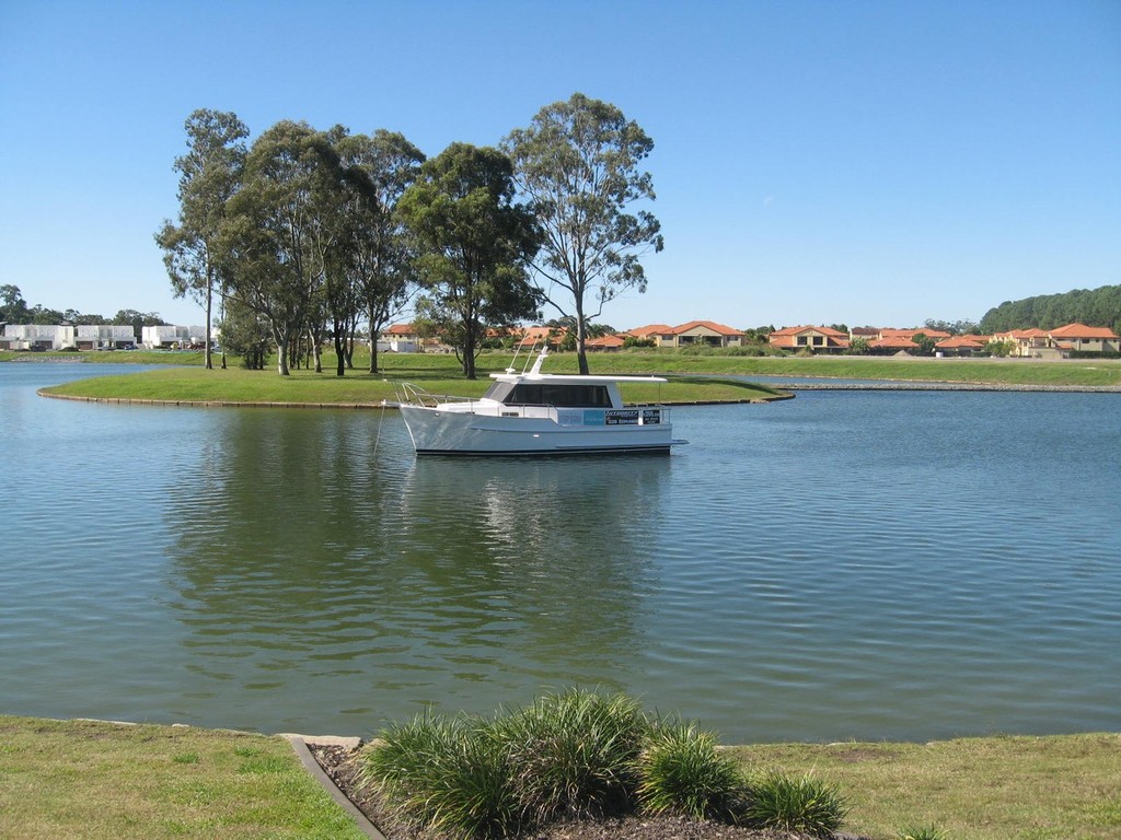Integrity 320 in the lake at Sanctuary Cove 001 photo copyright Jeni Bone taken at  and featuring the  class