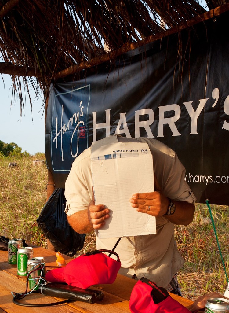 Mount Gay Rum 2012 Neptune Regatta. Why does the Regatta Director have his head in a cardboard box? (Trust us, it's to do with checking lights). photo copyright Guy Nowell/ Mt Gay Rum Neptune Regatta taken at  and featuring the  class