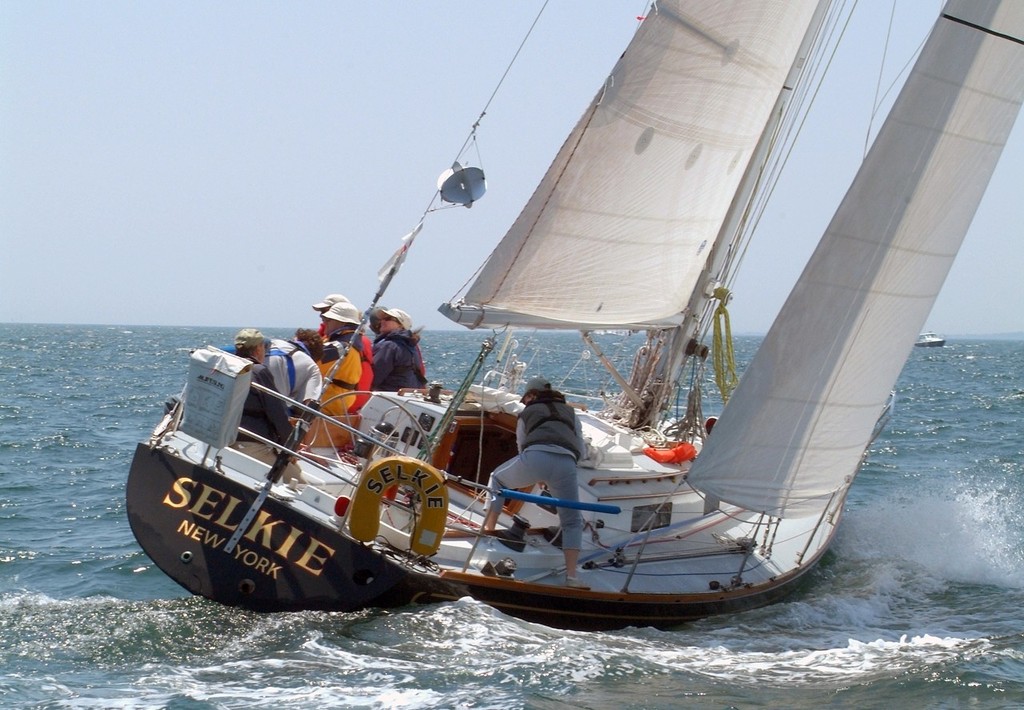 Sheila McCurdy's family boat Selkie powers upwind at the start of the 2008 Newport Bermuda Races. Selkie will see her 10th Newport Bermuda Race in 2012. McCurdy has been aboard on all the races, 3 as navigator for her father Jim McCurdy, the boat's designer and 6 as both skipper and navigator. In 2008 Selkie finishes 2nd in class and 2nd in the St. David's Lighthouse Division. 
Credit Talbot Wilson photo copyright Talbot Wilson taken at  and featuring the  class