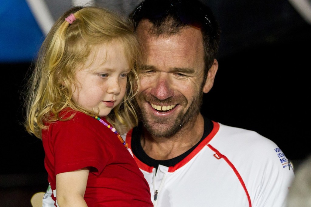 Mike Sanderson with his daughter. Team Sanya, skippered by Mike Sanderson from New Zealand finish sixth on leg 3 of the Volvo Ocean Race 2011-12 from Abu Dhabi, UAE, to Sanya, China. (Credit: IAN ROMAN/Volvo Ocean Race) photo copyright Ian Roman/Volvo Ocean Race http://www.volvooceanrace.com taken at  and featuring the  class