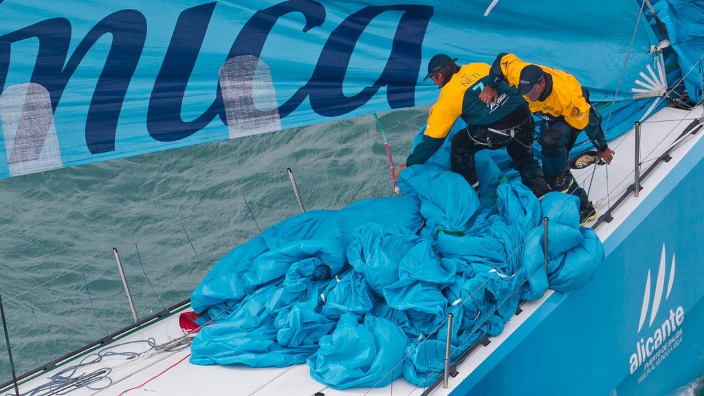 Bowman Zane Gills and Antonio Cuervas-Mons trying to control the jennaker, onboard Team Telefonica, skippered by Iker Martinez from Spain, in the Sanya Haitang Bay In-Port Race, during the Volvo Ocean Race 2011-12. (Credit: IAN ROMAN/Volvo Ocean Race) © Ian Roman/Volvo Ocean Race http://www.volvooceanrace.com