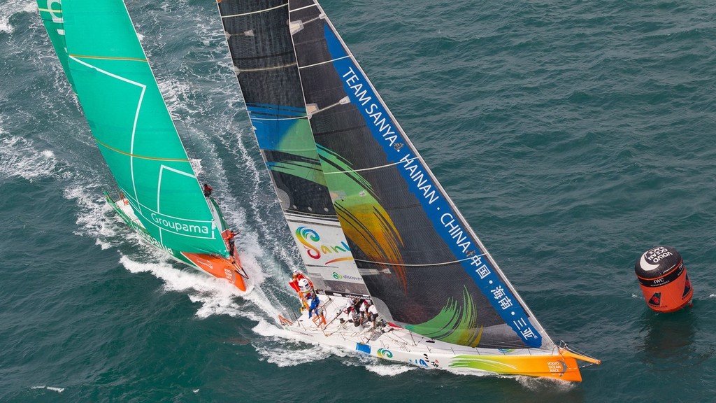 Team Sanya, skippered by Mike Sanderson from New Zealand leading Groupama Sailing Team, skippered by Franck Cammas from France into a mark rounding, in the Sanya Haitang Bay In-Port Race, during the Volvo Ocean Race 2011-12. (Credit: IAN ROMAN/Volvo Ocean Race) © Ian Roman/Volvo Ocean Race http://www.volvooceanrace.com