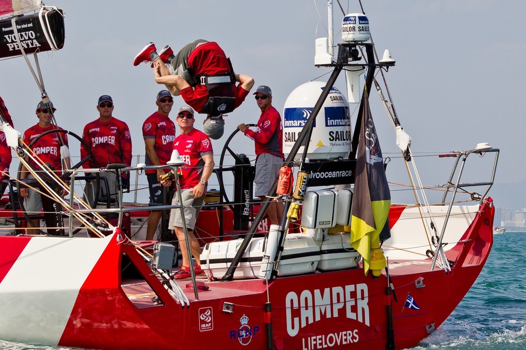 World Champion gymnast and 3 time Olympic Gold medalist Yang Wei from China somersaults off the back of Camper  at the start of leg 4 of the Volvo Ocean Race 2011-12, from Sanya, China to Auckland, New Zealand photo copyright Ian Roman/Volvo Ocean Race http://www.volvooceanrace.com taken at  and featuring the  class