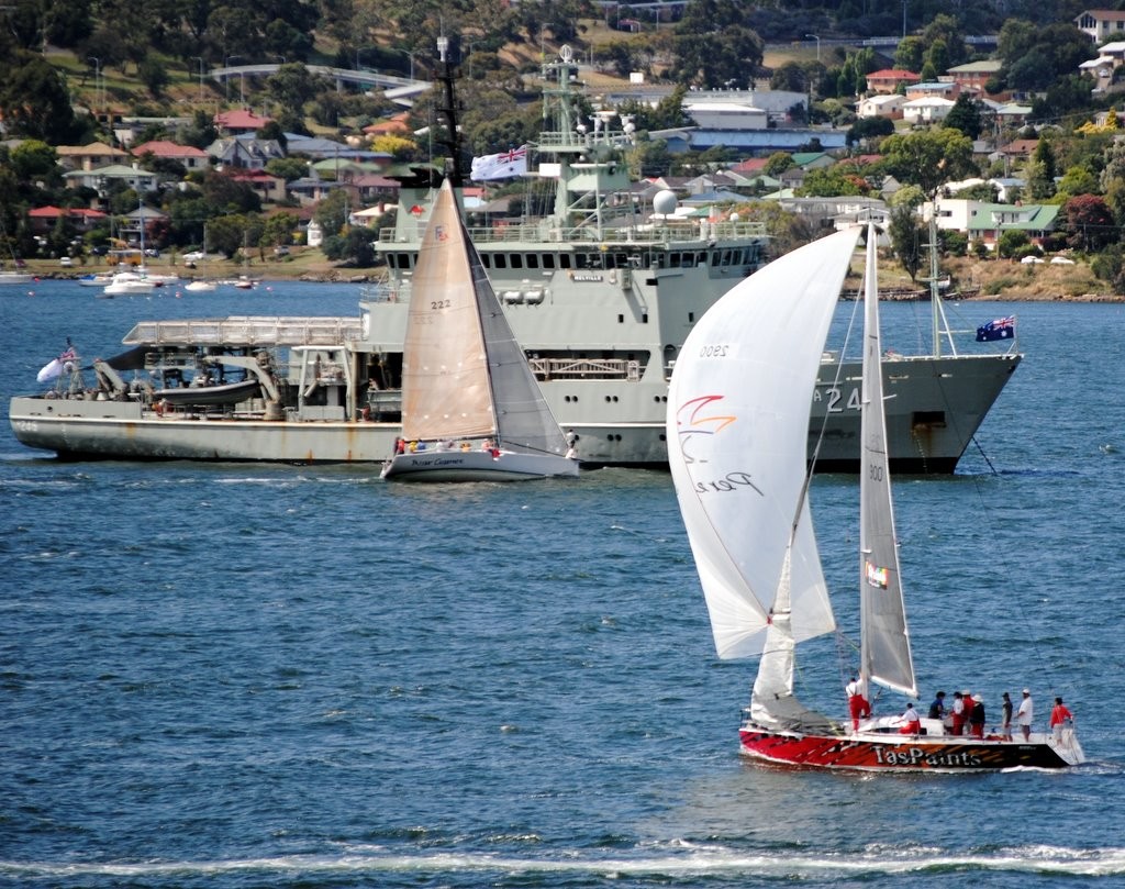 War Games sails past the Regatta flagship, HMAS Melville, as TasPaints runs down to the leeward mar - Royal Hobart Regatta 2012 photo copyright Rob Cruse taken at  and featuring the  class