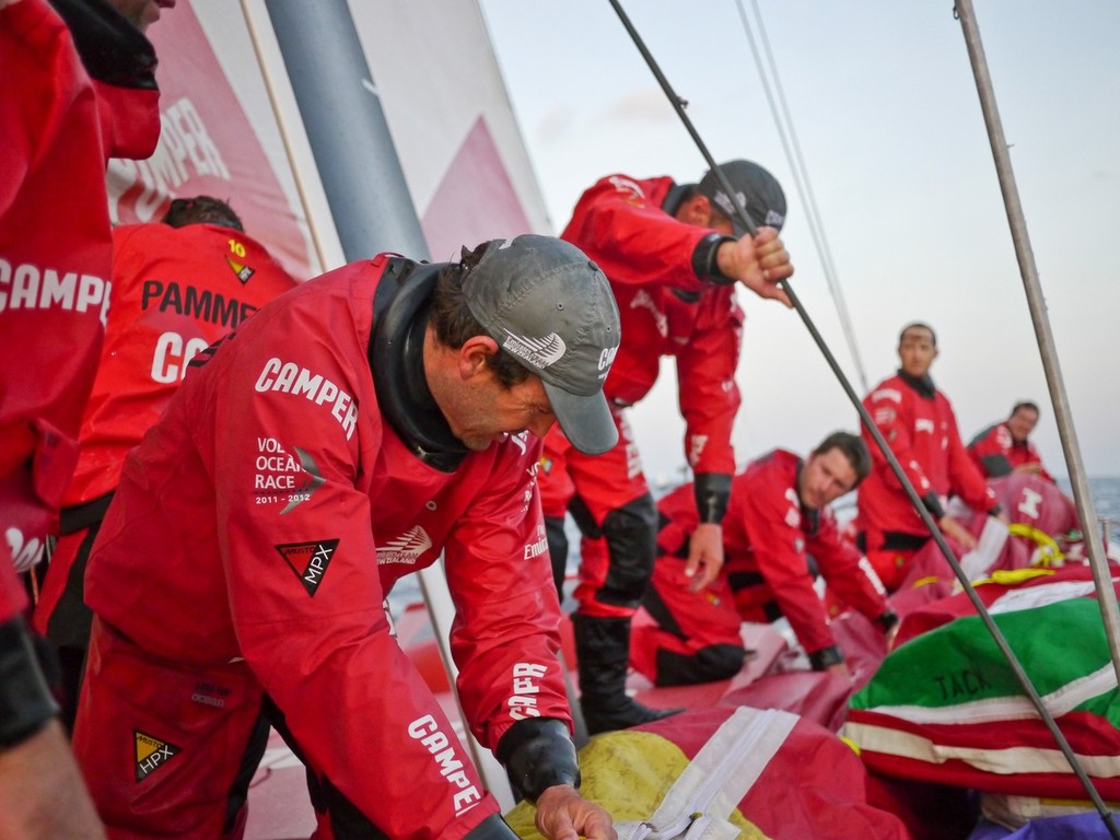 Chris Nicholson and Roberto Bermudez de Castro help everyone shift a sail after a sail change onboard CAMPER with Emirates Team New Zealand during leg 3 of the Volvo Ocean Race 2011-12, from Abu Dhabi, UAE to Sanya, China.  © Hamish Hooper/Camper ETNZ/Volvo Ocean Race