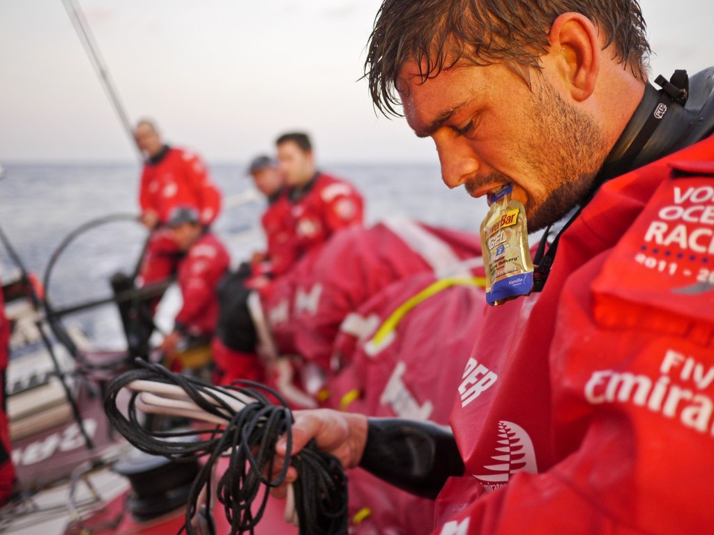Bowman Mike Pammenter reaches for a Power Gel shot for a boost of energy towards the end of his watch onboard CAMPER with Emirates Team New Zealand during leg 3 of the Volvo Ocean Race 2011-12, from Abu Dhabi, UAE to Sanya, China.  © Hamish Hooper/Camper ETNZ/Volvo Ocean Race