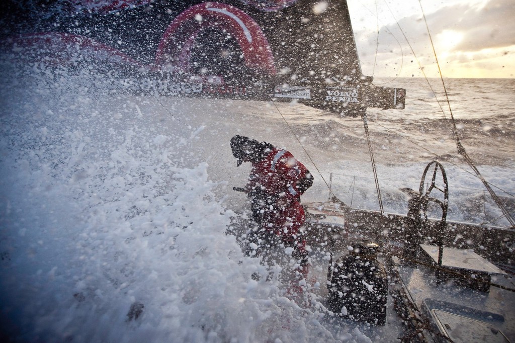 Casey Smith ducks his head in anticipation of the coming torrent, onboard PUMA Ocean Racing powered by BERG during leg 4 of the Volvo Ocean Race 2011-12, from Sanya, China to Auckland, New Zealand. (Credit: Amory Ross/PUMA Ocean Racing/Volvo Ocean Race) photo copyright Amory Ross/Puma Ocean Racing/Volvo Ocean Race http://www.puma.com/sailing taken at  and featuring the  class