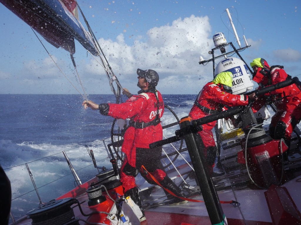 Andy McLean putting a reef in the mainsail onboard Camper during leg 4 of the Volvo Ocean Race 2011-12, from Sanya, China to Auckland, New Zealand.  © Hamish Hooper/Camper ETNZ/Volvo Ocean Race