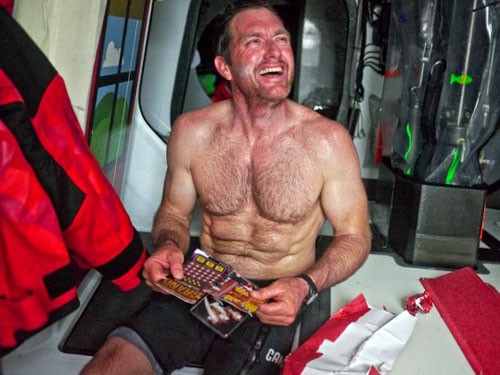Tony Rae enjoys the moment of opening a christmas present onboard CAMPER with Emirates Team New Zealand during leg 2 of the Volvo Ocean Race 2011-12, from Cape Town, South Africa to Abu Dhabi, UAE. © Hamish Hooper/Camper ETNZ/Volvo Ocean Race