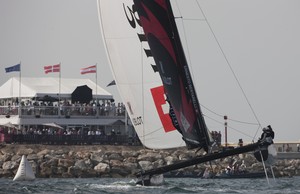 Day 3 - Alinghi flying in front of the crowds of spectators at the race village in The Wave, Muscat - Extreme Sailing Series 2012. Act 1 photo copyright Lloyd Images http://lloydimagesgallery.photoshelter.com/ taken at  and featuring the  class