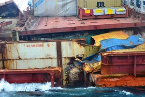 Rena container damage showing timber cargo starboard side 5 Jan - Rena Disaster - 5 January 2012 photo copyright Maritime NZ www.maritimenz.govt.nz taken at  and featuring the  class