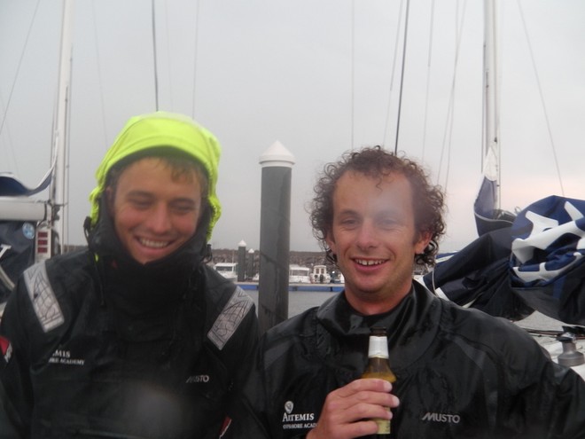 Sam Goodchild and Nick Cherry catch up on the stormy docks after finishing leg 1 - La Solitaire du Figaro 2012 © Artemis Offshore Academy www.artemisonline.co.uk