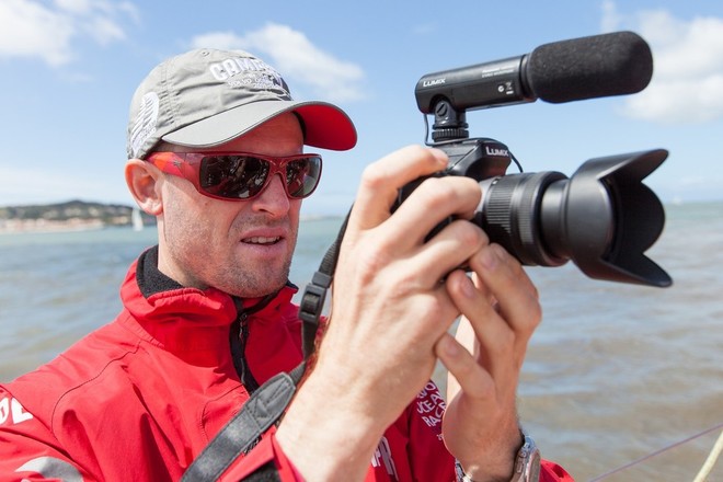 Media Crew Member, Hamish Hooper in action, onboard Camper with Emirates Team New Zealand, during the practice race in Lisbon, during the Volvo Ocean Race 2011-12.  © Ian Roman/Volvo Ocean Race http://www.volvooceanrace.com