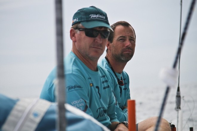 Navigator Andrew Cape and skipper Iker Martinez on deck onboard Team Telefonica during leg 7 of the Volvo Ocean Race 2011-12, from Miami, USA to Lisbon, Portugal. © Diego Fructuoso /Team Telefónica/Volvo Ocean Race http://www.volvooceanrace.com