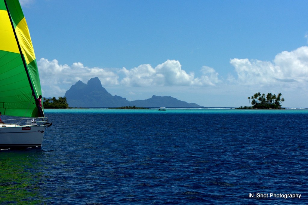 Light winds on the 4th day provided this stunning backdrop of Bora Bora as the fleet passed around Tahaa - Tahiti Pearl Regatta 2012  © Michele Rogers