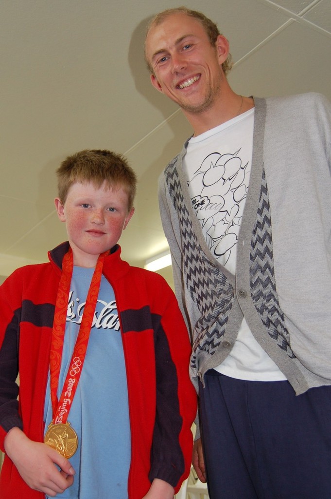 ``Here. Try it on champ...`` Patrick Haybittle meets Tom Ashley for the first time, 2008 MBSC Winter Champs - A chance meeting in a Kiwi Yacht Club spurs a dream. photo copyright Brian Haybittle taken at  and featuring the  class