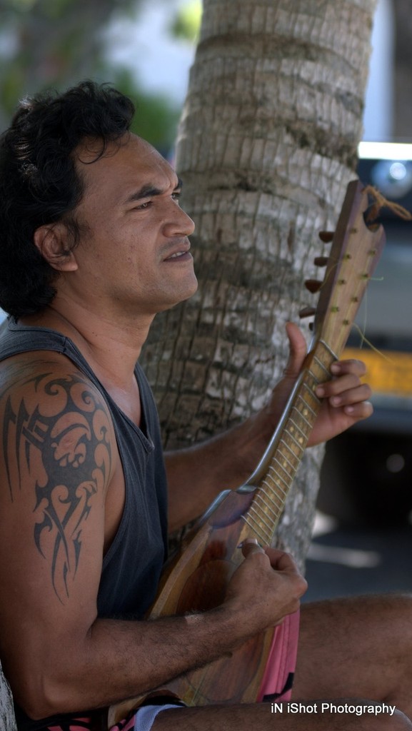 On a great note there is nothing better than strumming under a palm with Hinano. - Tahiti Pearl Regatta 2012  © Michele Rogers
