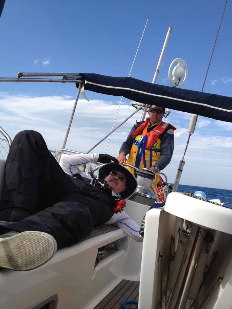 The wind is picking up.  Doug Abott is at the helm of Inception while crew member Greg Cameron takes a break. - ORCV Melbourne to Port Fairy Race © Jennifer Cook