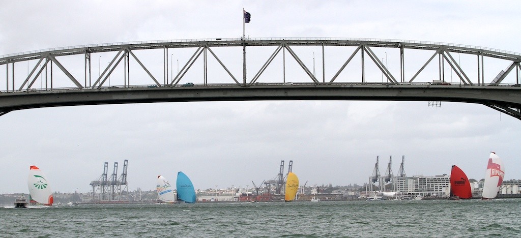 The fleet head towards Aucklands Harbour bridge - Volvo Ocean Race 2011 - 2012 photo copyright Greg Mulvaney - copyright http://www.gregmulvaney.com taken at  and featuring the  class