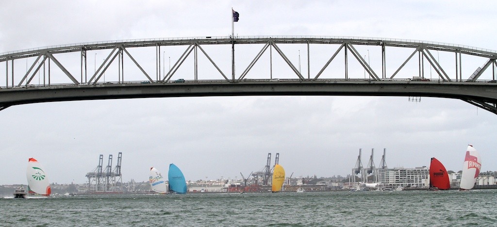 The fleet head towards Aucklands Harbour bridge - Volvo Ocean Race 2011 - 2012 © Greg Mulvaney - copyright http://www.gregmulvaney.com