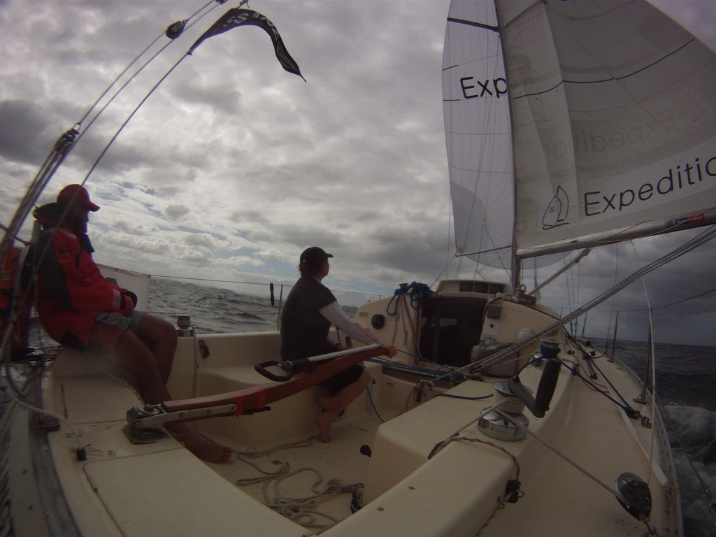 Sally steers Expedition Coppelia near Kawau - Rob shoots the breeze - 2012 Two Handed Round New Zealand Race - Expedition Coppelia<br />
<br />
 © SW