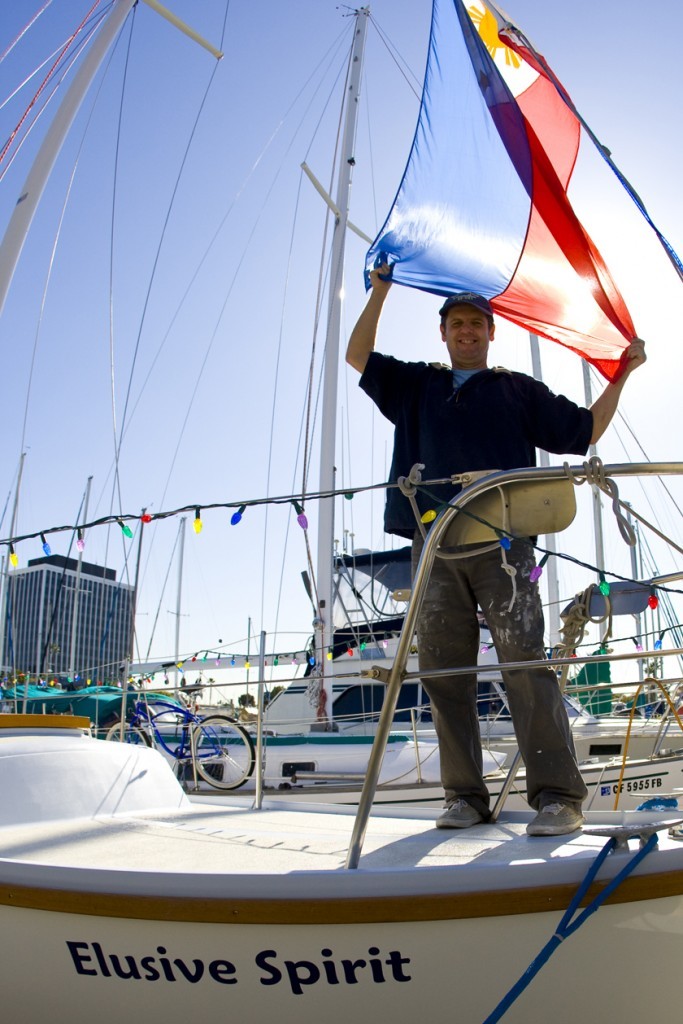 Jim Sullivan with flag photo copyright  SW taken at  and featuring the  class