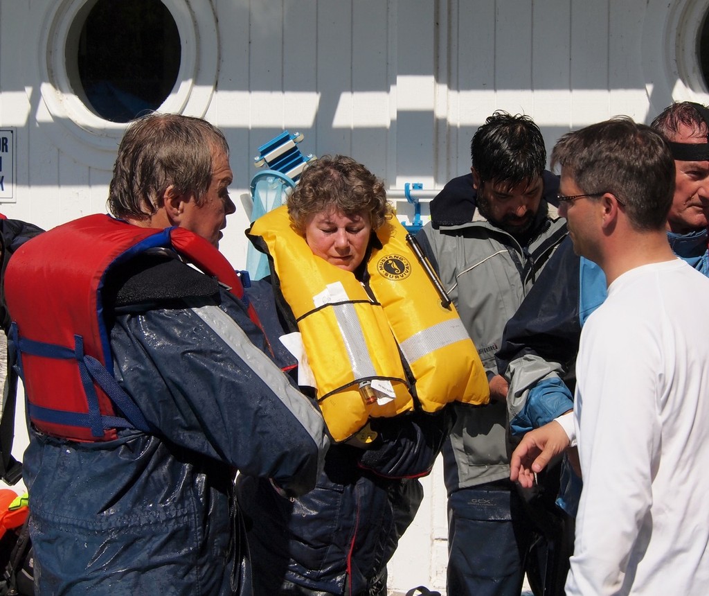 Instructor Eric Hill helping husband and wife sailors David Weatherston and Sue Howson with equipment © Greg Nicoll