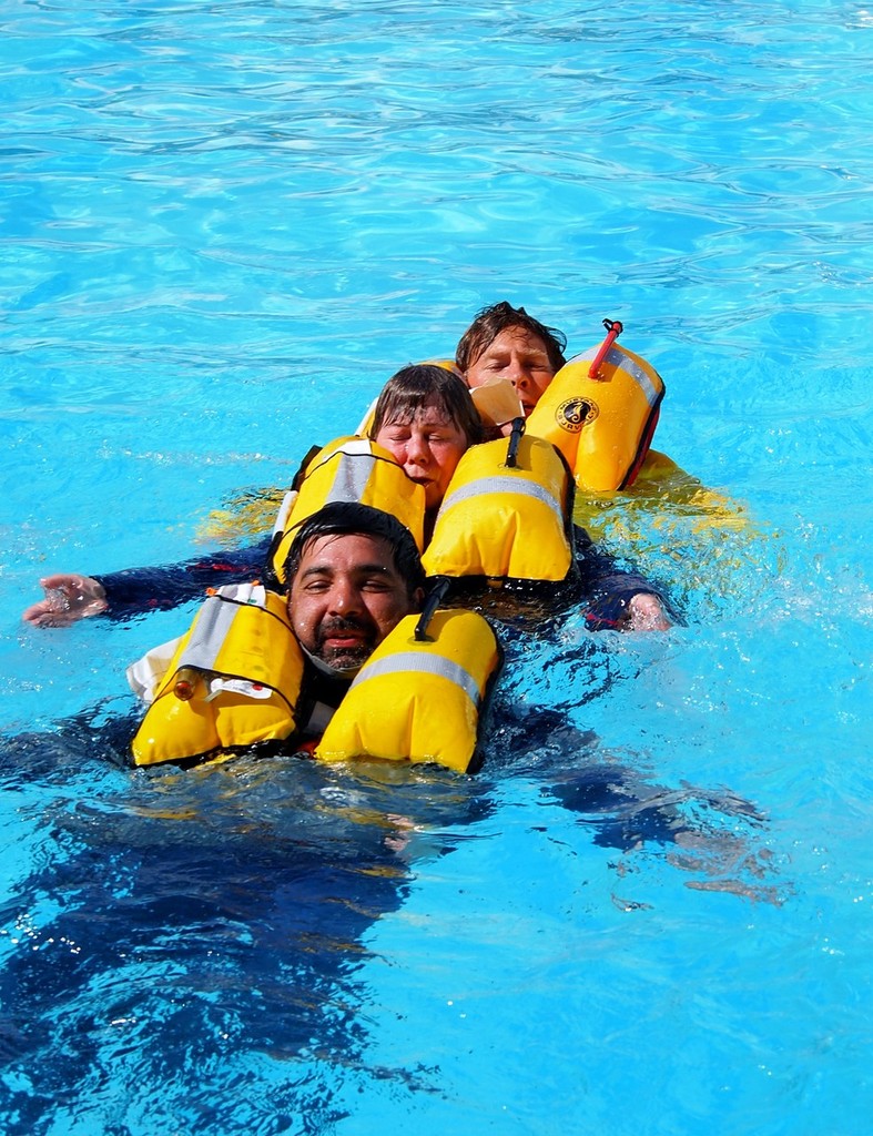 Swimmers working as a team to stay together photo copyright Greg Nicoll taken at  and featuring the  class