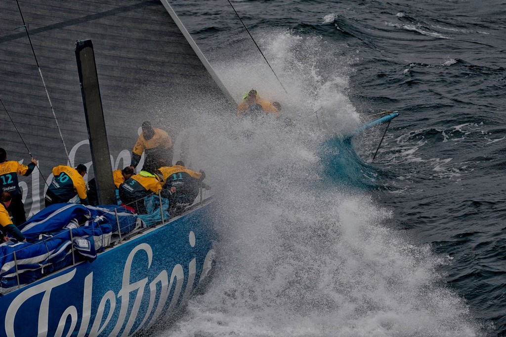 Team Telefonica, skippered by Iker Martinez from Spain, changing sails in rough weather, at the start of leg 5 from Auckland, New Zealand to Itajai, Brazil, during the Volvo Ocean Race 2011-12.  © Paul Todd/Volvo Ocean Race http://www.volvooceanrace.com